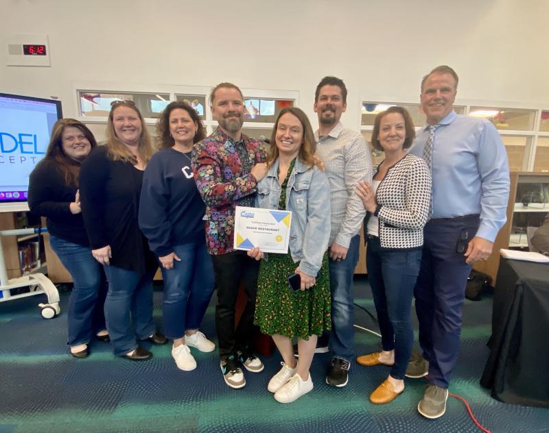Agave was recognized for its work with Sussex Consortium students. Gathered are (l-r) job coach Stacey Jones, job coach Christina Strunk, Sussex Consortium Vocational Coordinator Pam Graves, Kitchen Manager Scott Beach, Director of Operations Tammi Beach, General Manager Peter Good, school board President Alison Myers and Cape Superintendent Bob Fulton. ELLEN DRISCOLL PHOTOS